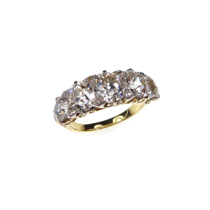 Antique five stone diamond ring with graduated cushion cut stones